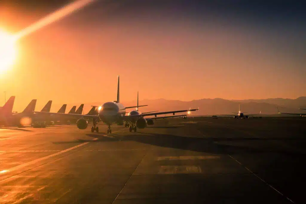 Sun,Flare,At,The,Airport,During,Sunset,With,Many,Aircraft