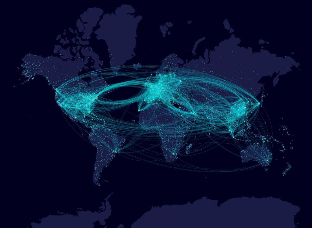 A dark world map shows blue lines connecting major cities, illustrating global air traffic routes with dense clusters in North America, Europe, and Asia, highlighting busy international travel networks.