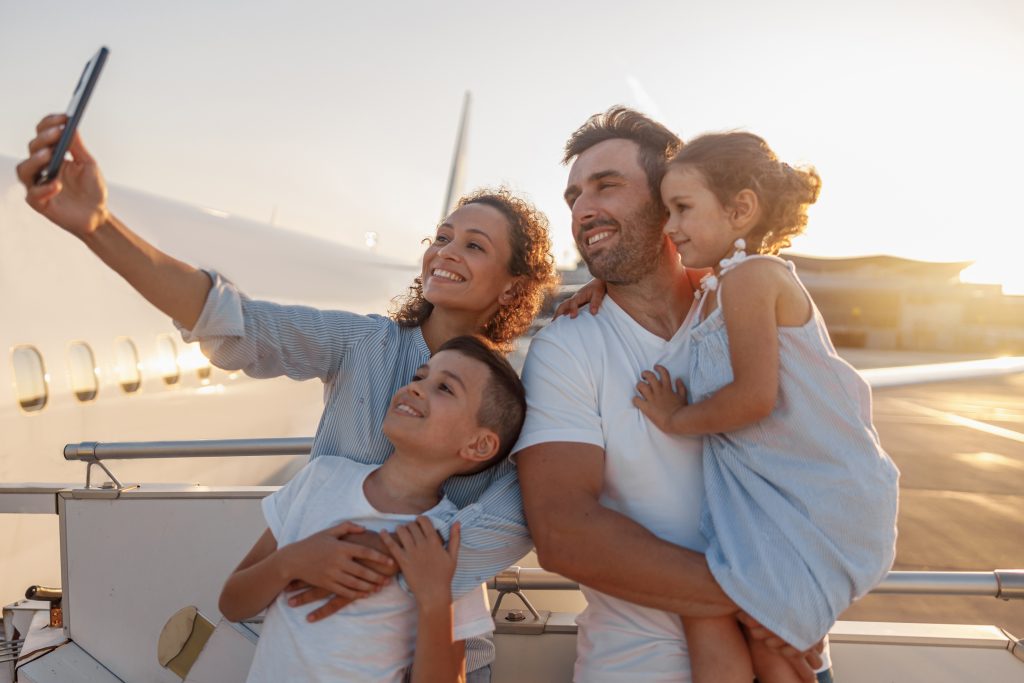 Happy,Tourists,,Beautiful,Family,Taking,Selfie,While,Standing,Together,Outdoors