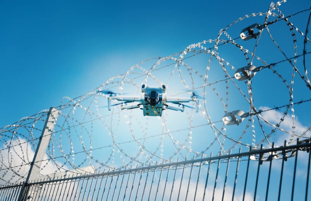 Airport runway aerial view with RF drone detection sensor network overlay illustrating counter-UAS coverage zones